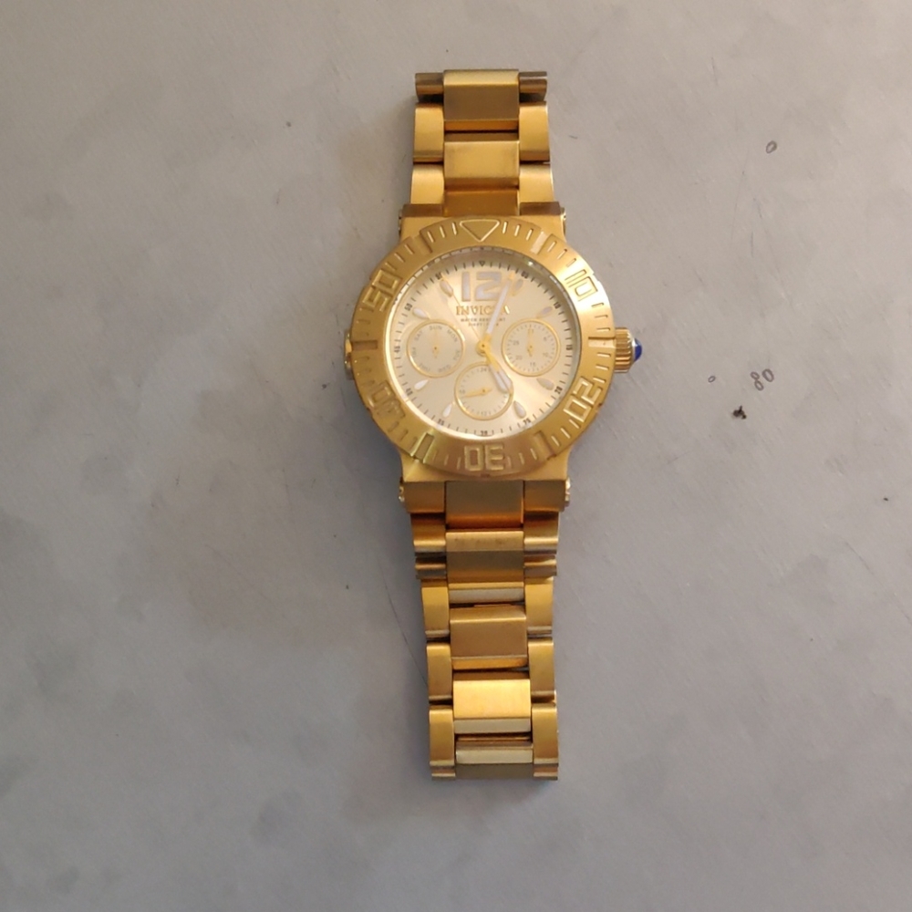 Gold Invicta watch
